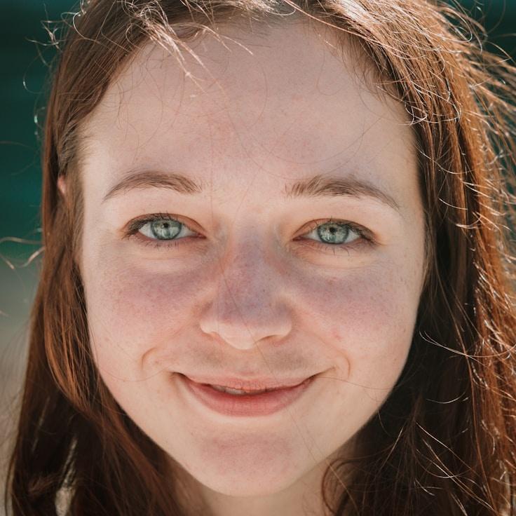 Avery Chen, Lead Design Curator at Balanced Origin Route, reviewing corporate floral arrangements